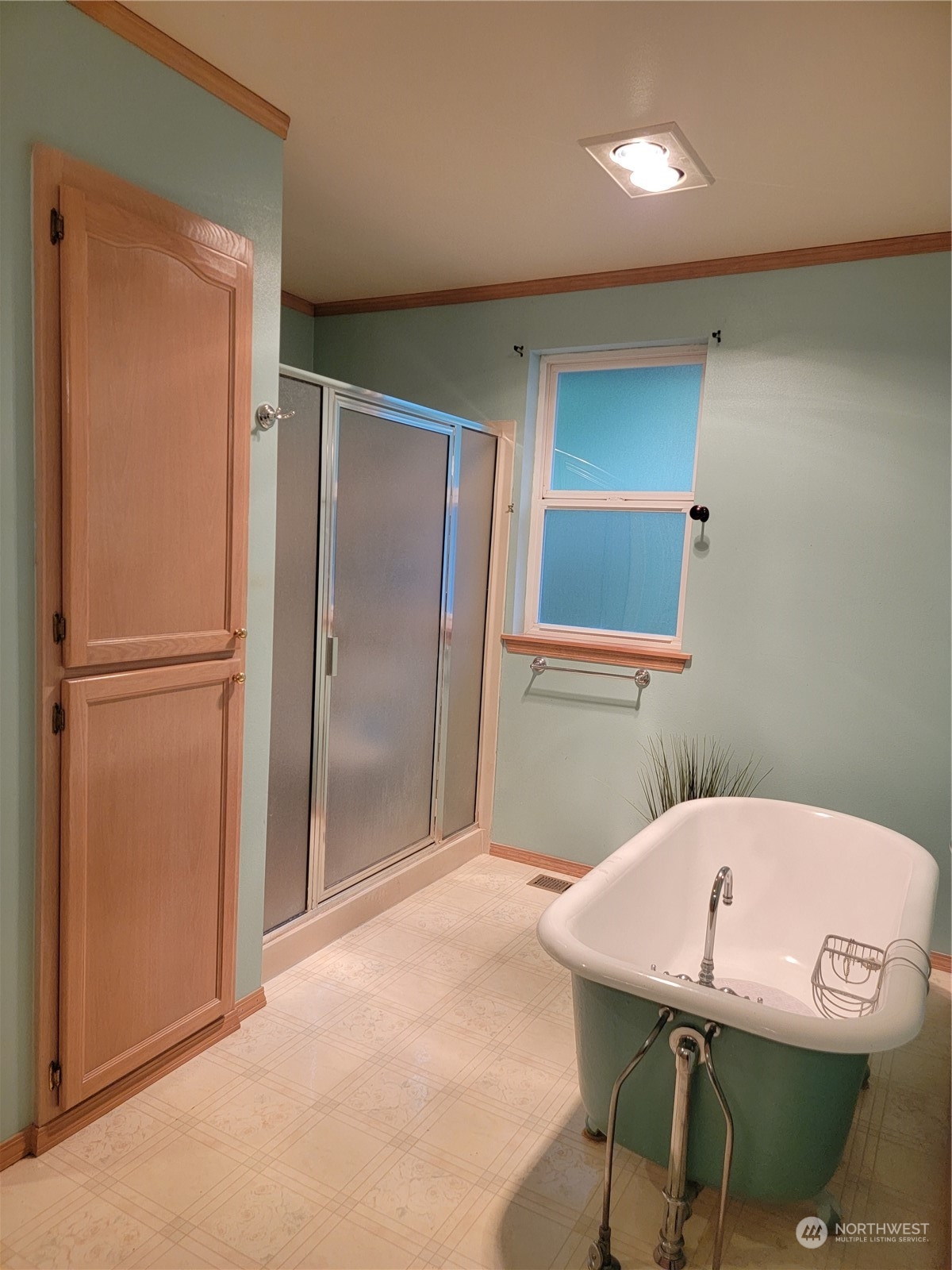19618 Jordan Road Arlington, WA 98223 - Photo 32 of 32 a bathroom with a sink a mirror and a shower