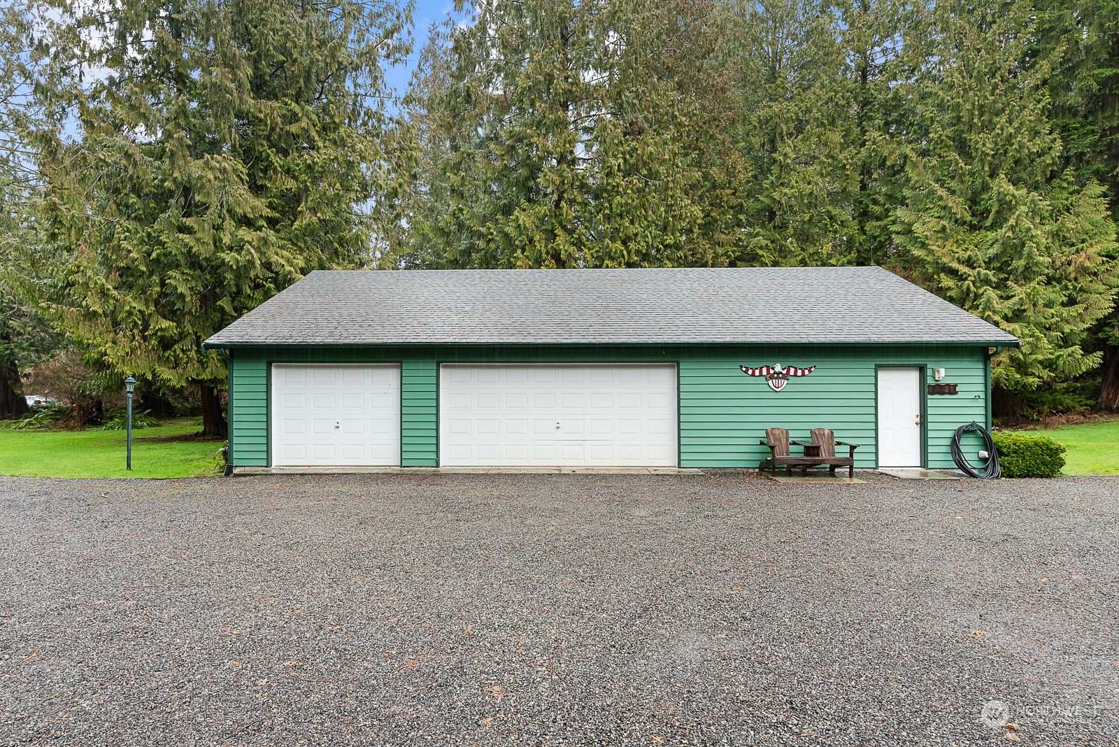 19618 Jordan Road Arlington, WA 98223 - Photo 4 of 32 a view of a house with a yard and garage