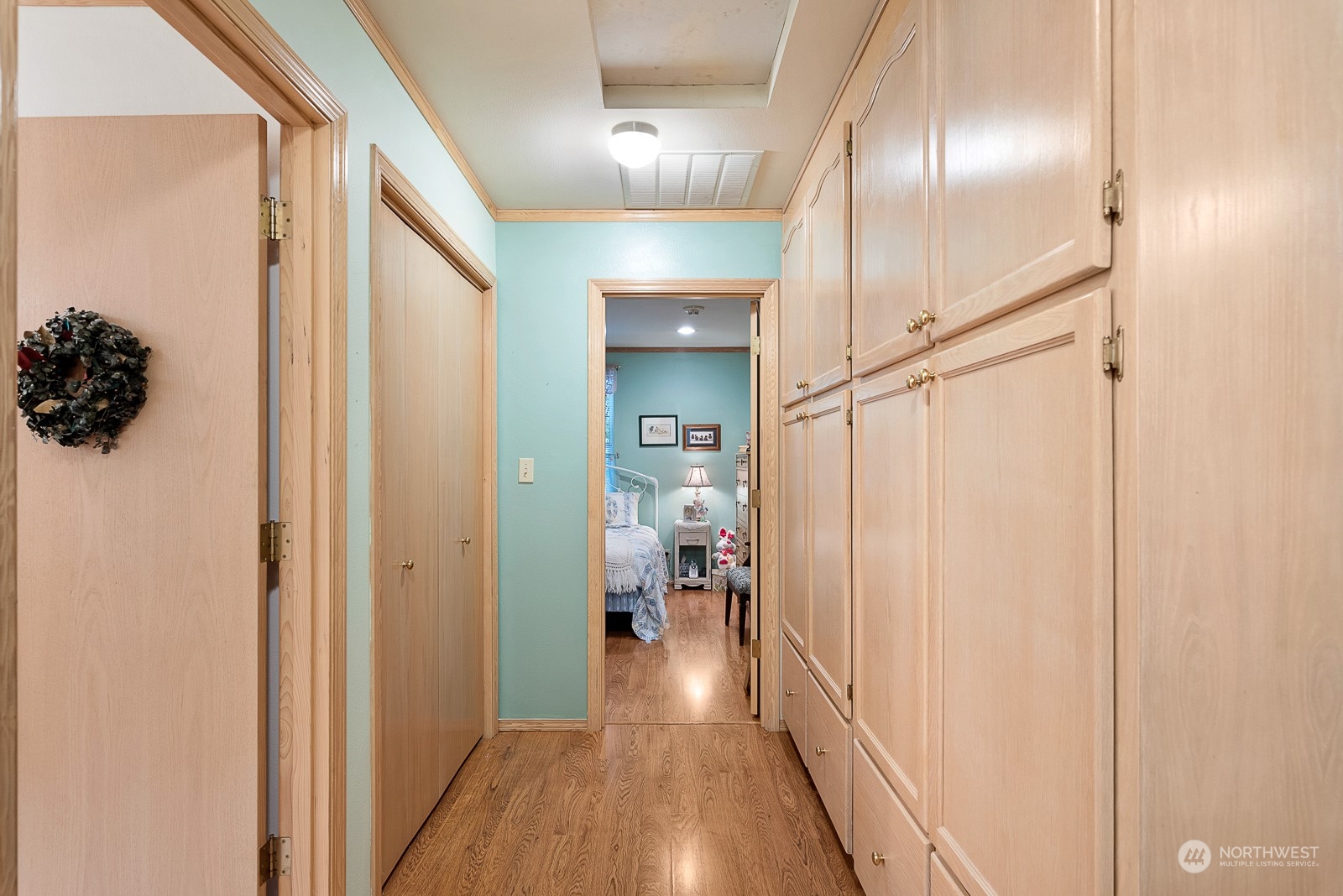 19618 Jordan Road Arlington, WA 98223 - Photo 9 of 32 a view of a hallway with wooden floor closet and bathroom