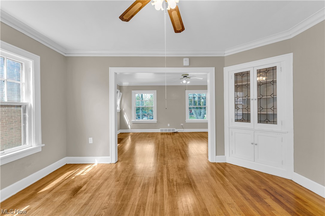 3609 Strandhill Road Shaker Heights, OH 44122 - Photo 20 of 47 Unfurnished room with light hardwood / wood-style flooring, ceiling fan, and ornamental molding