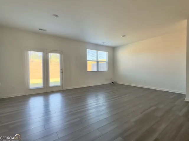 a view of kitchen and wooden floor