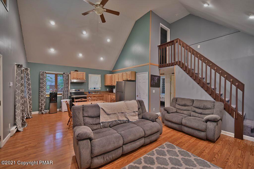 152 Canterbury Road Bushkill, PA 18324 - Photo 13 of 57 a living room with furniture ceiling fan and a rug