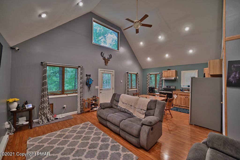 152 Canterbury Road Bushkill, PA 18324 - Photo 15 of 57 a living room with furniture and a flat screen tv