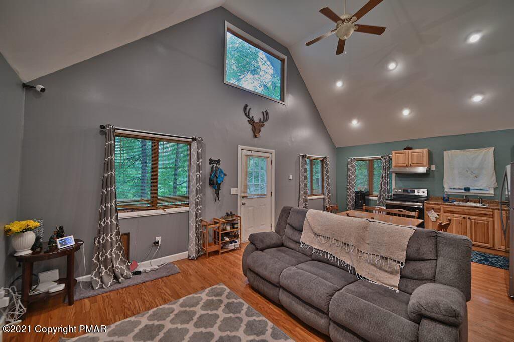 152 Canterbury Road Bushkill, PA 18324 - Photo 16 of 57 a living room with furniture and a window