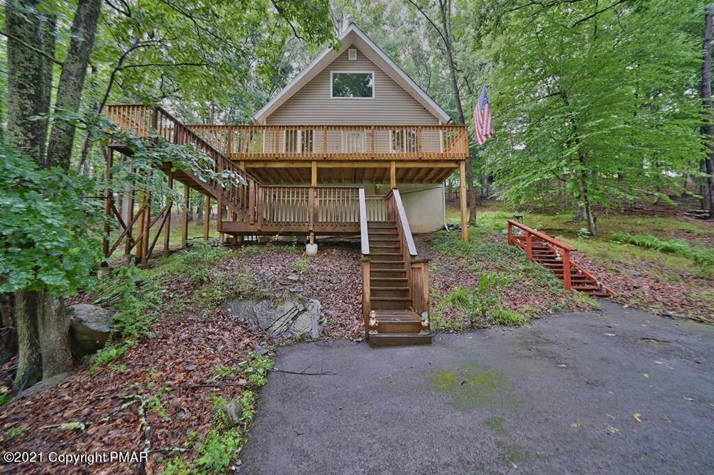 152 Canterbury Road Bushkill, PA 18324 - Photo 2 of 57 a view of a house with a yard and large trees