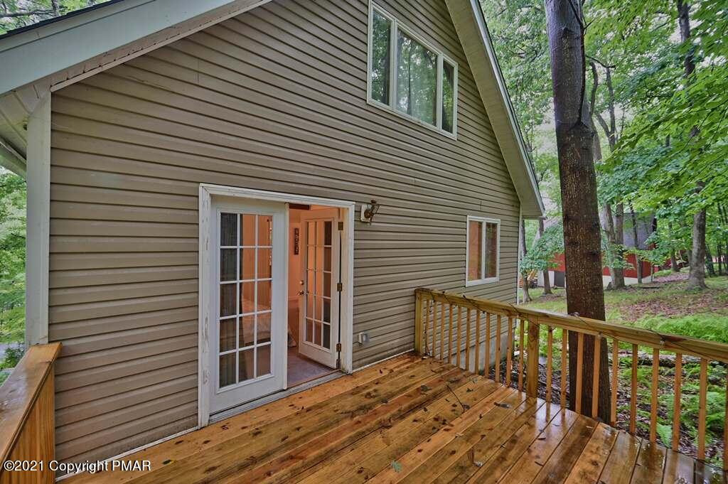 152 Canterbury Road Bushkill, PA 18324 - Photo 24 of 57 a view of a wooden deck and a yard