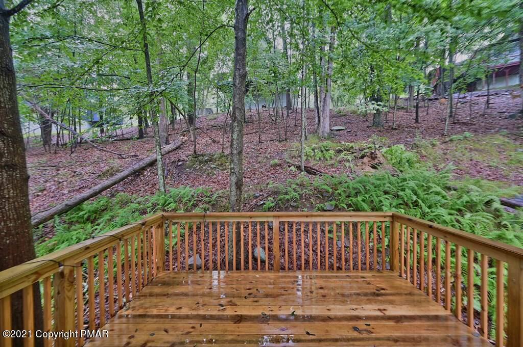 152 Canterbury Road Bushkill, PA 18324 - Photo 26 of 57 a view of deck and backyard with trees
