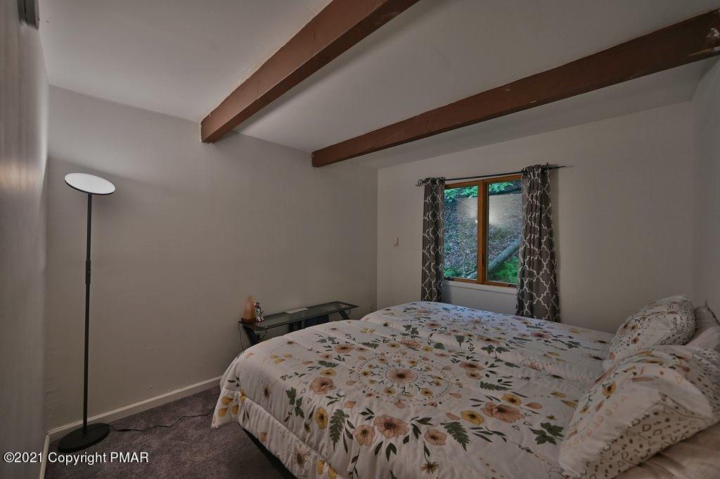 152 Canterbury Road Bushkill, PA 18324 - Photo 27 of 57 a bedroom with a bed and a mirror