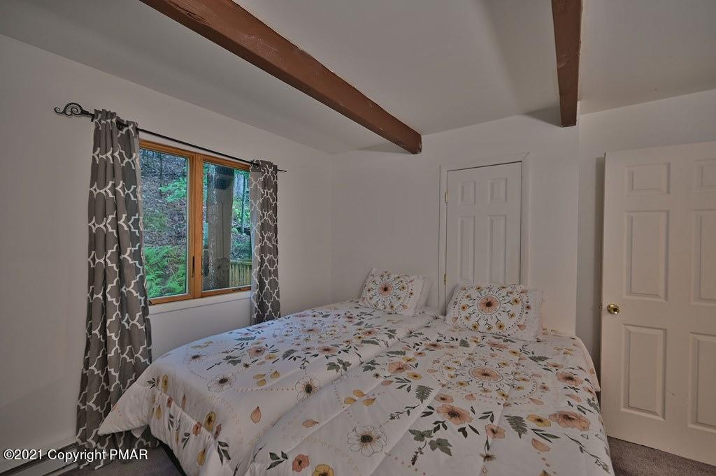 152 Canterbury Road Bushkill, PA 18324 - Photo 28 of 57 a bedroom with a bed and a window