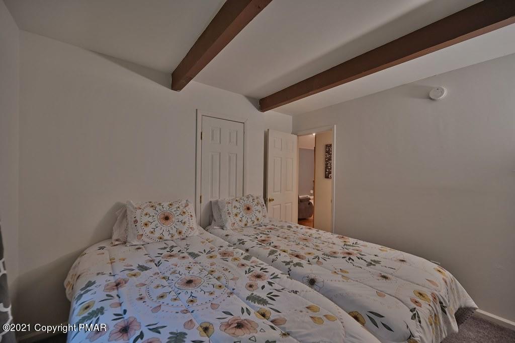 152 Canterbury Road Bushkill, PA 18324 - Photo 29 of 57 a bedroom with a bed and a window