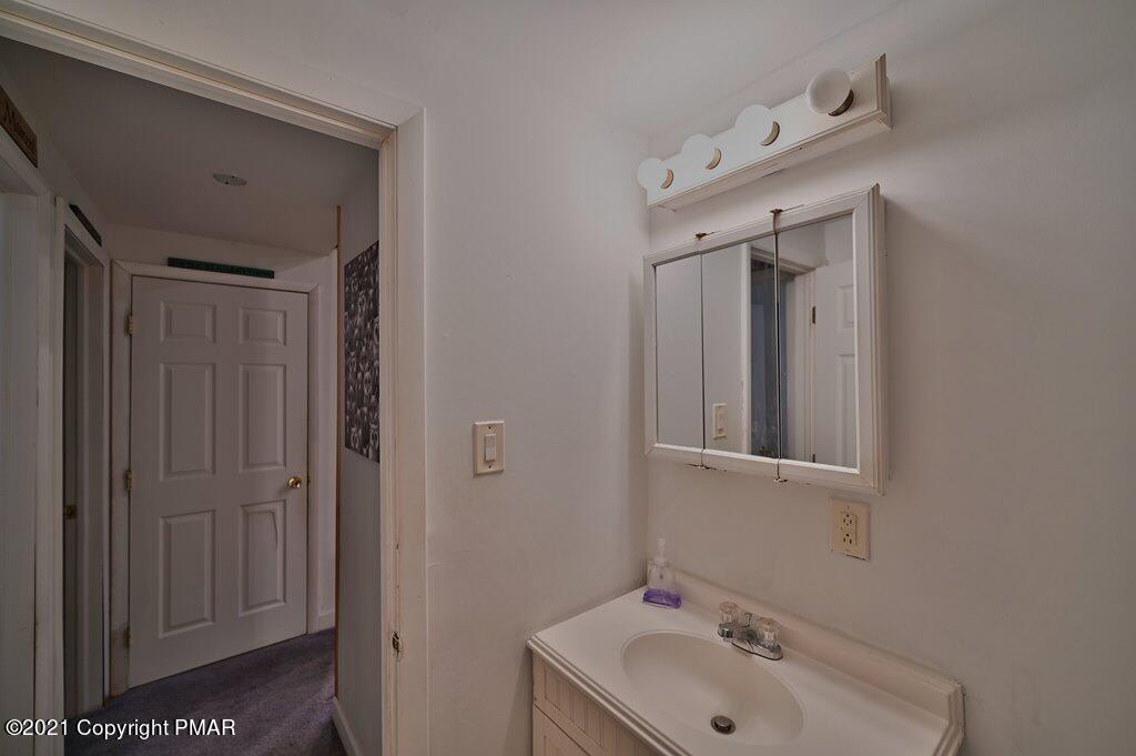 152 Canterbury Road Bushkill, PA 18324 - Photo 31 of 57 a bathroom with a sink and a mirror