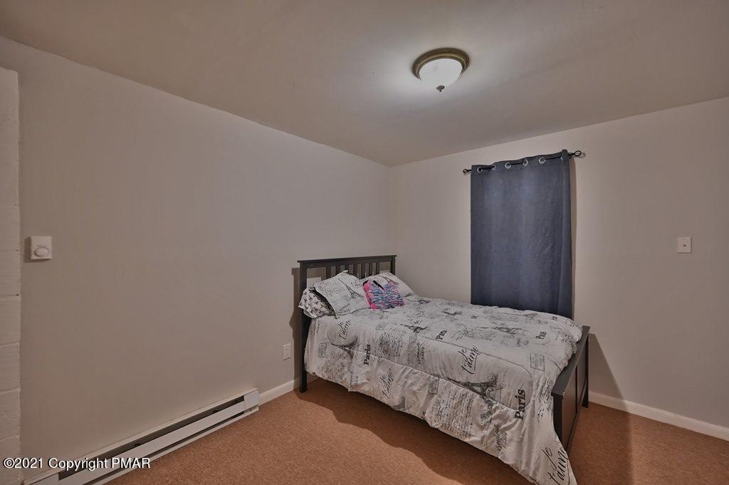 152 Canterbury Road Bushkill, PA 18324 - Photo 33 of 57 a bedroom with a bed and a window