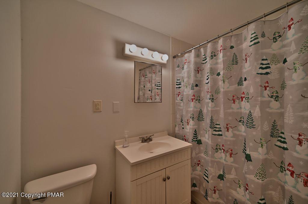 152 Canterbury Road Bushkill, PA 18324 - Photo 36 of 57 a bathroom with a sink and mirror with toilet