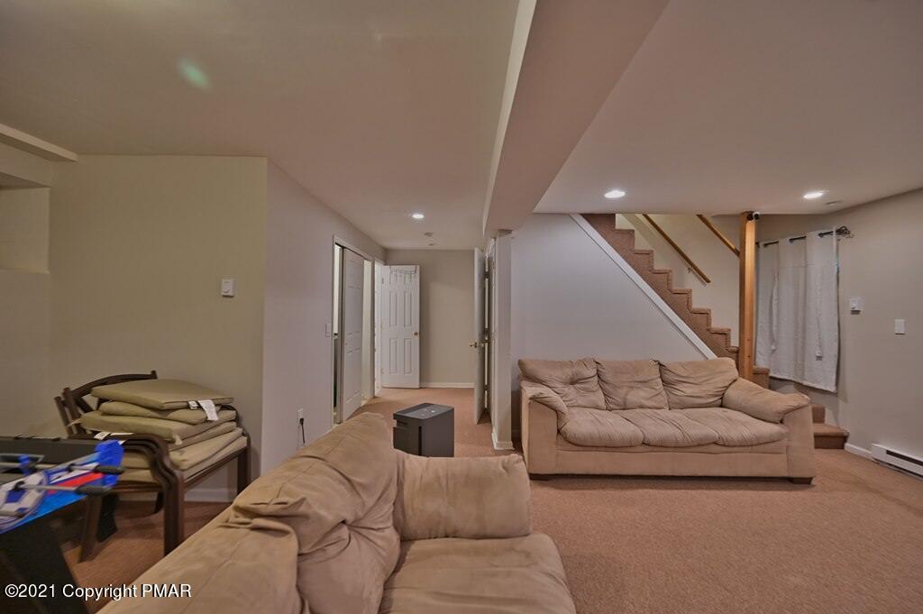 152 Canterbury Road Bushkill, PA 18324 - Photo 42 of 57 a living room with furniture and a couch