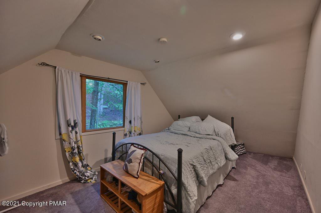 152 Canterbury Road Bushkill, PA 18324 - Photo 44 of 57 a bedroom with a bed and a window