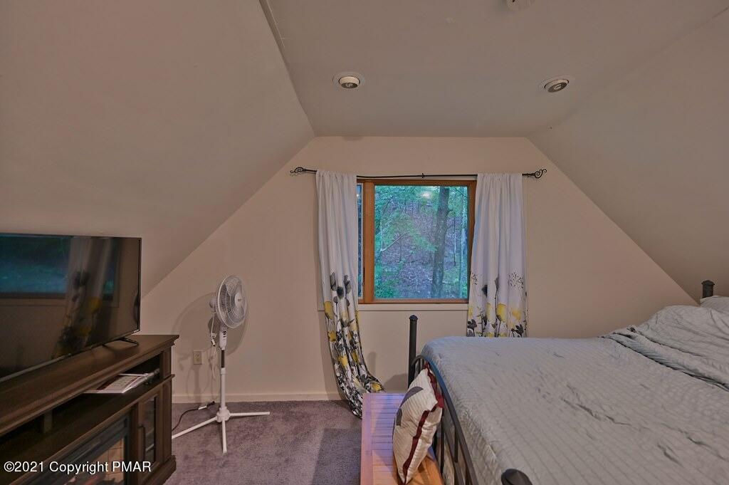 152 Canterbury Road Bushkill, PA 18324 - Photo 46 of 57 a bedroom with a bed and a flat screen tv
