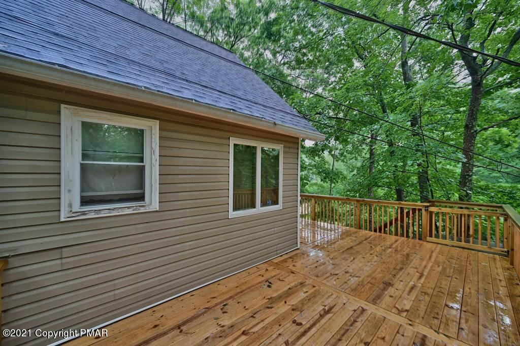 152 Canterbury Road Bushkill, PA 18324 - Photo 5 of 57 a view of a house with a balcony