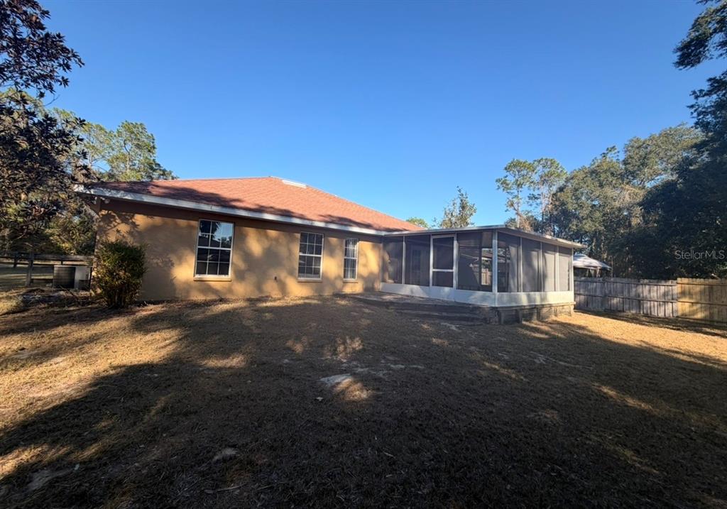 1221 Poe Street Inverness, FL 34450 - Photo 11 of 11 a front view of a house with a yard