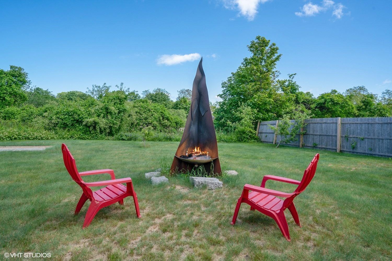 17 Wareham Avenue Onset, MA 02558 - Photo 14 of 15 a backyard of a house with table and chairs