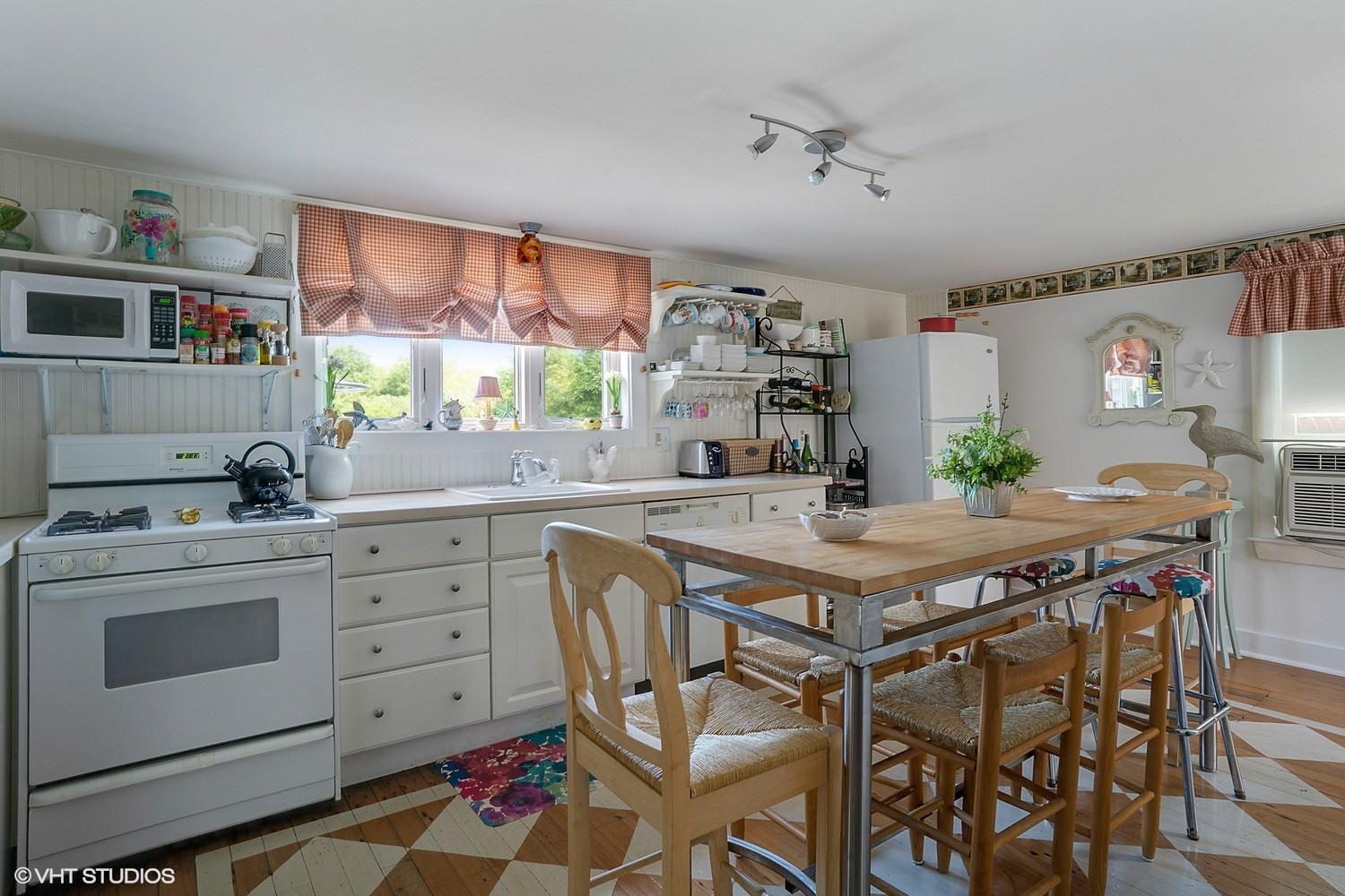 17 Wareham Avenue Onset, MA 02558 - Photo 3 of 15 a kitchen with stainless steel appliances a stove a sink cabinets and a dining table
