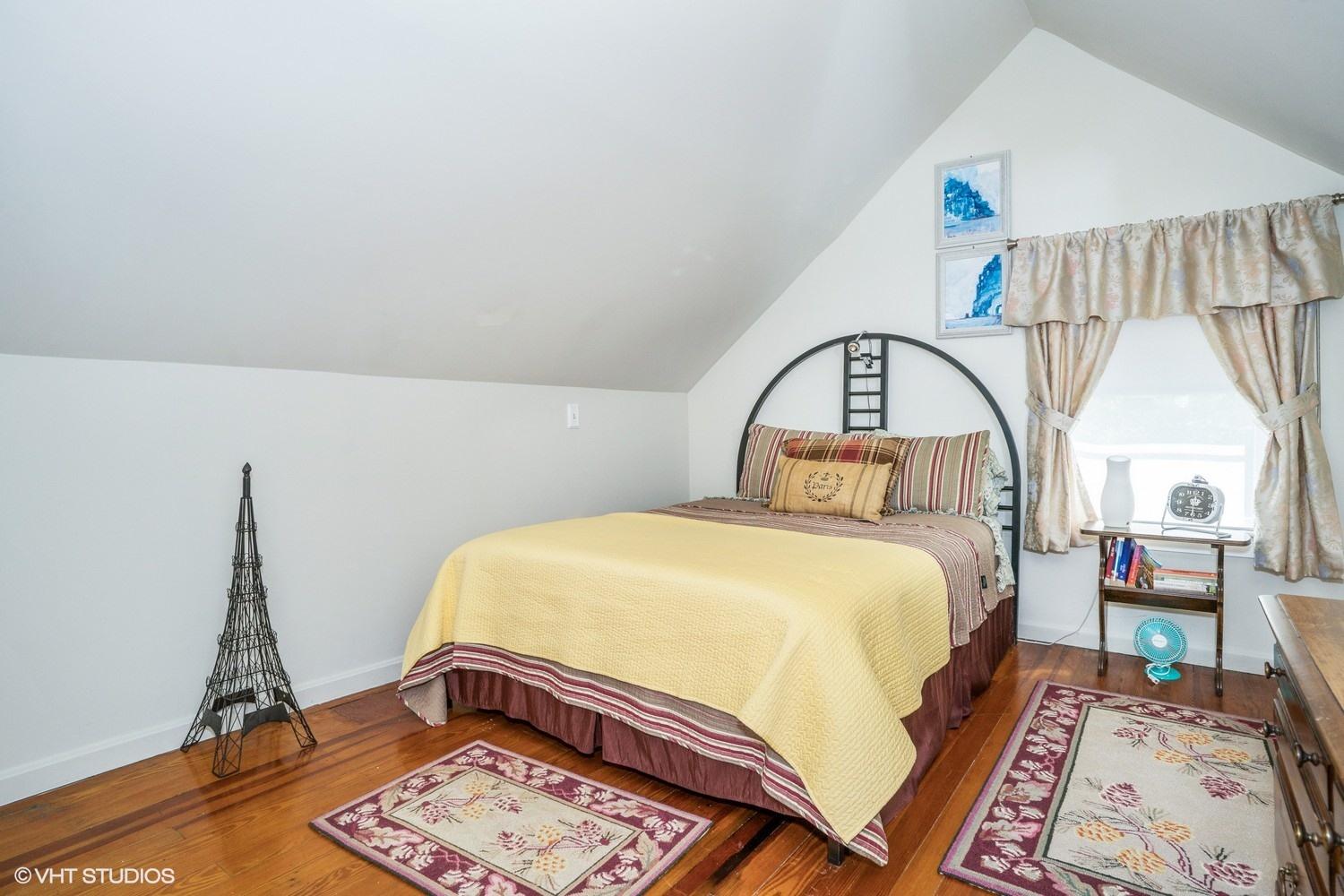 17 Wareham Avenue Onset, MA 02558 - Photo 9 of 15 a bedroom with a bed a mirror and a window