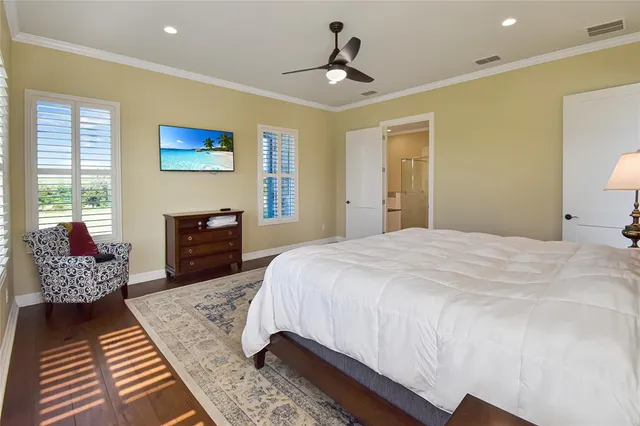 a spacious bedroom with a bed and a couch