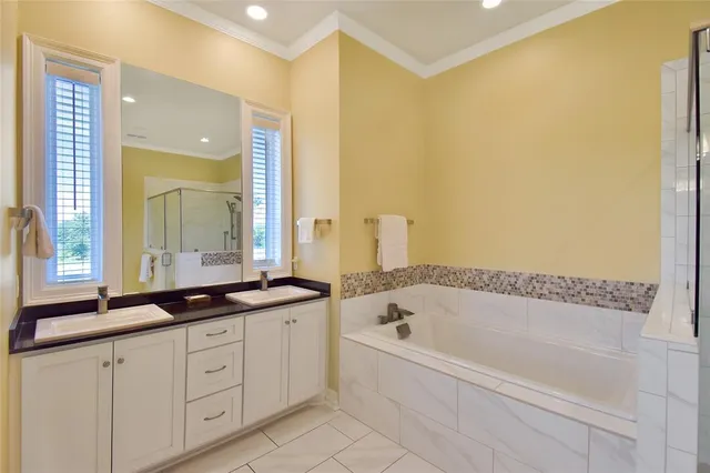 a bathroom with a bathtub and a sink