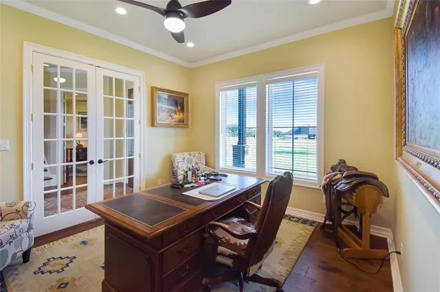 a view of a dining room with furniture and a window