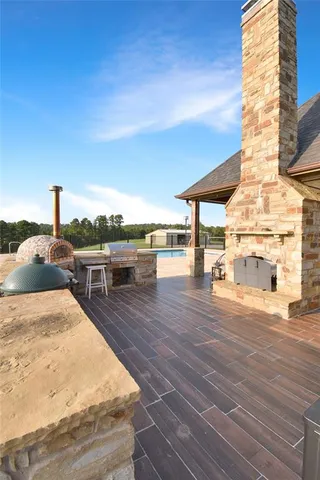 a view of a terrace with wooden floor and seating space
