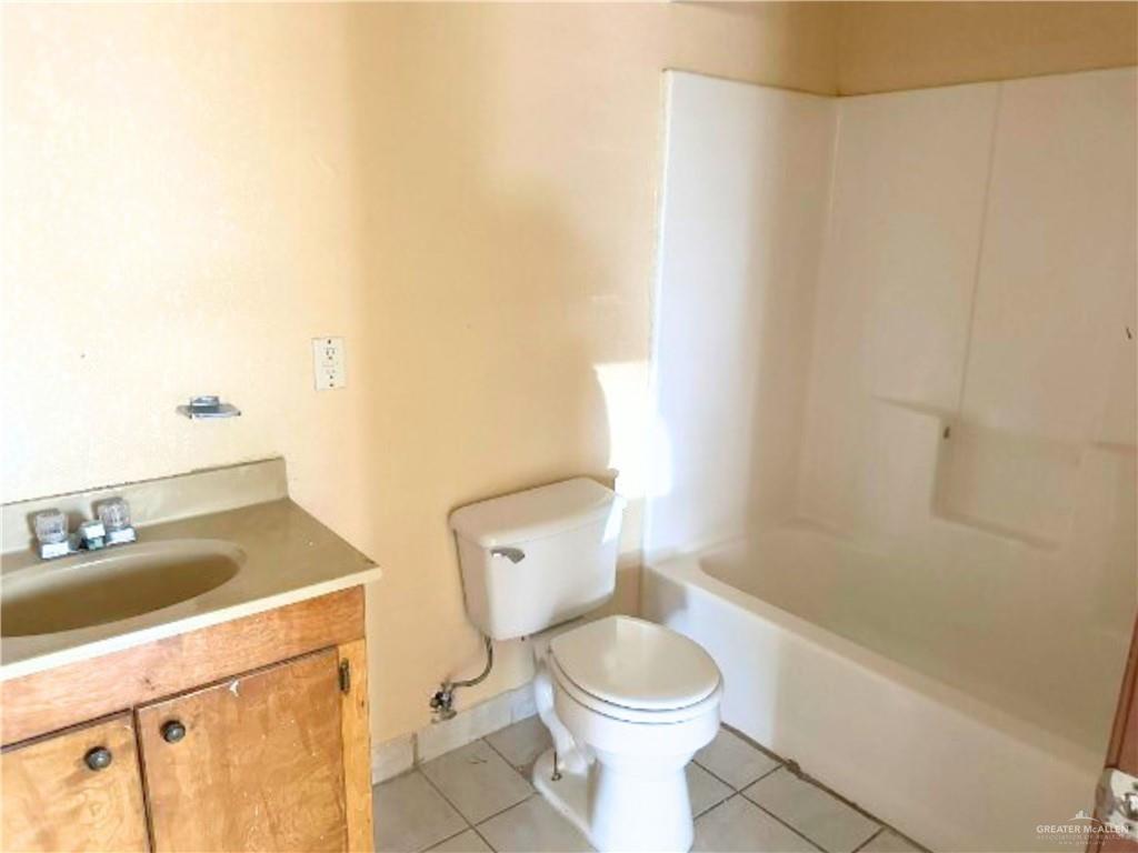 5007 East US Highway 83 Rio Grande City, TX 78582 - Photo 22 of 26 a bathroom with a sink a toilet and shower