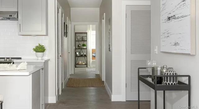 a kitchen with a fireplace and a window
