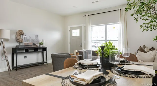 a living room with furniture and flowers
