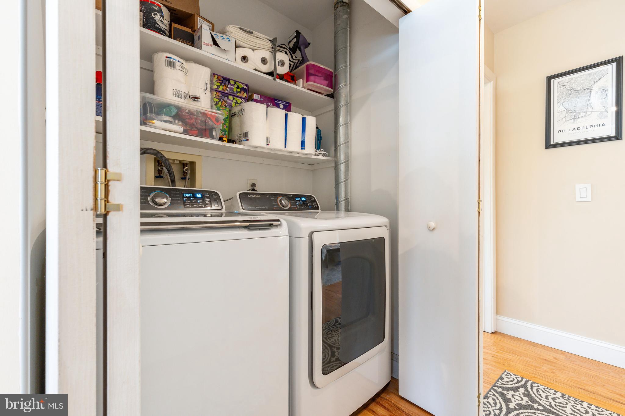 1900 Hamilton Street, Unit C6 Philadelphia, PA 19130 - Photo 15 of 37 a utility room with dryer washer and a fridge