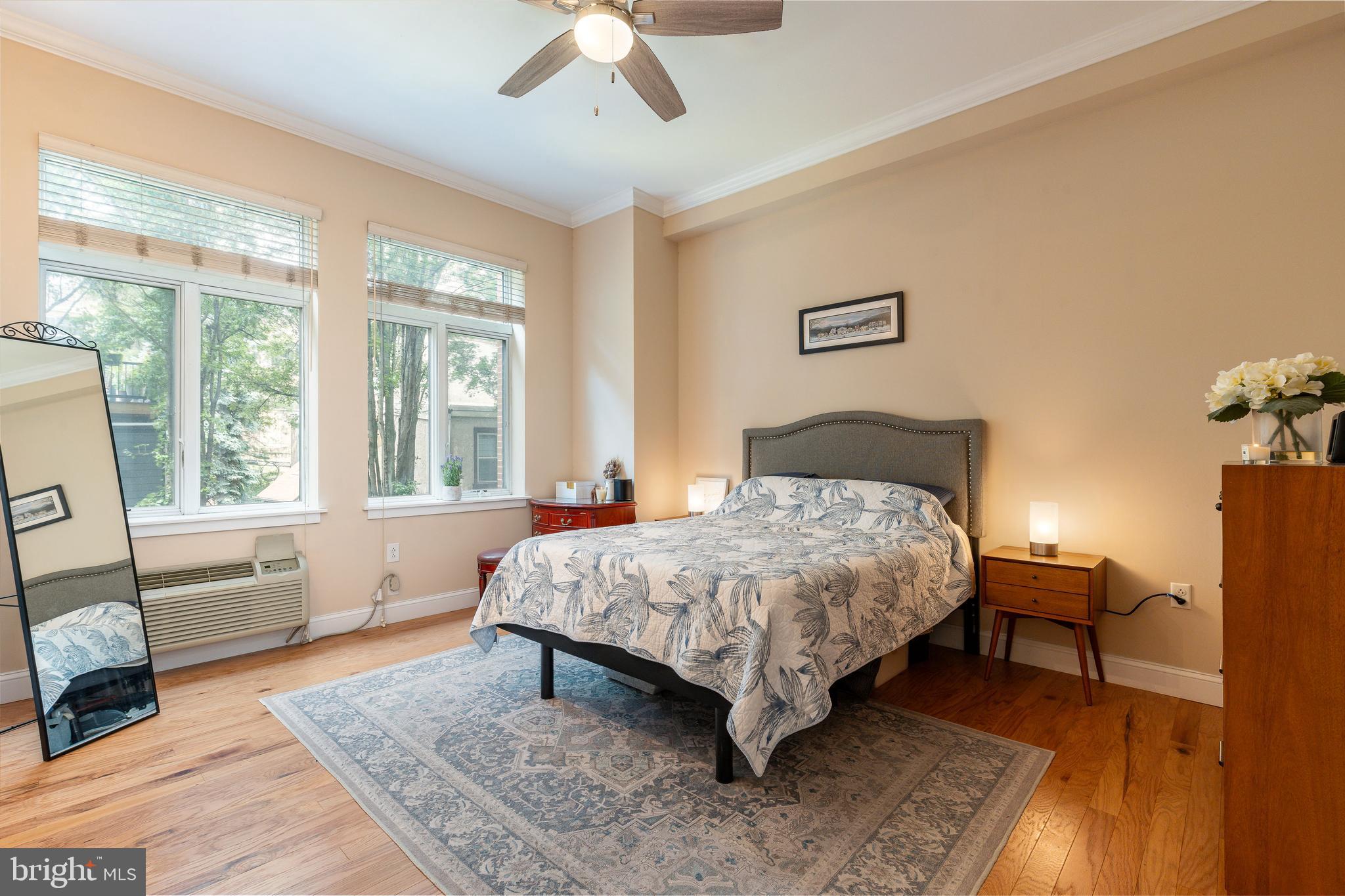 1900 Hamilton Street, Unit C6 Philadelphia, PA 19130 - Photo 18 of 37 a bedroom with a bed and wooden floor