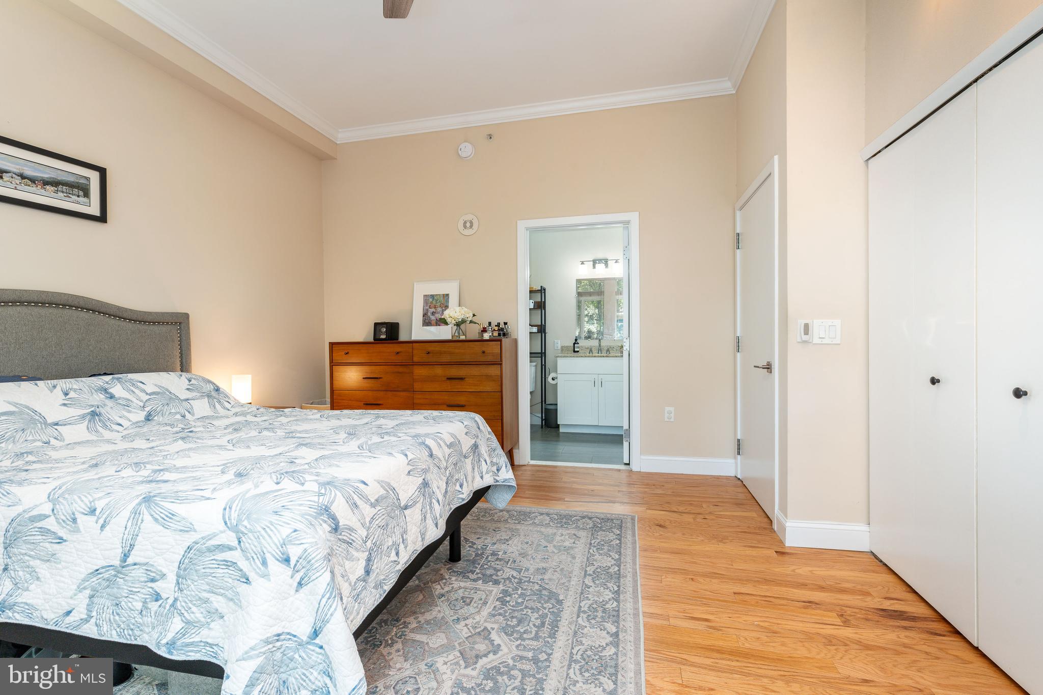 1900 Hamilton Street, Unit C6 Philadelphia, PA 19130 - Photo 19 of 37 a bedroom with a bed and wooden floor