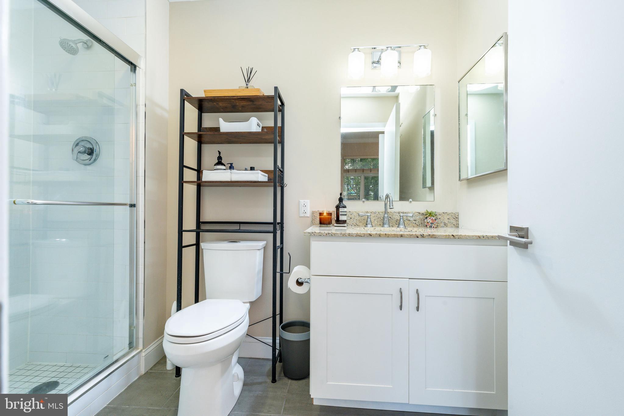 1900 Hamilton Street, Unit C6 Philadelphia, PA 19130 - Photo 20 of 37 a bathroom with a sink a toilet and shower
