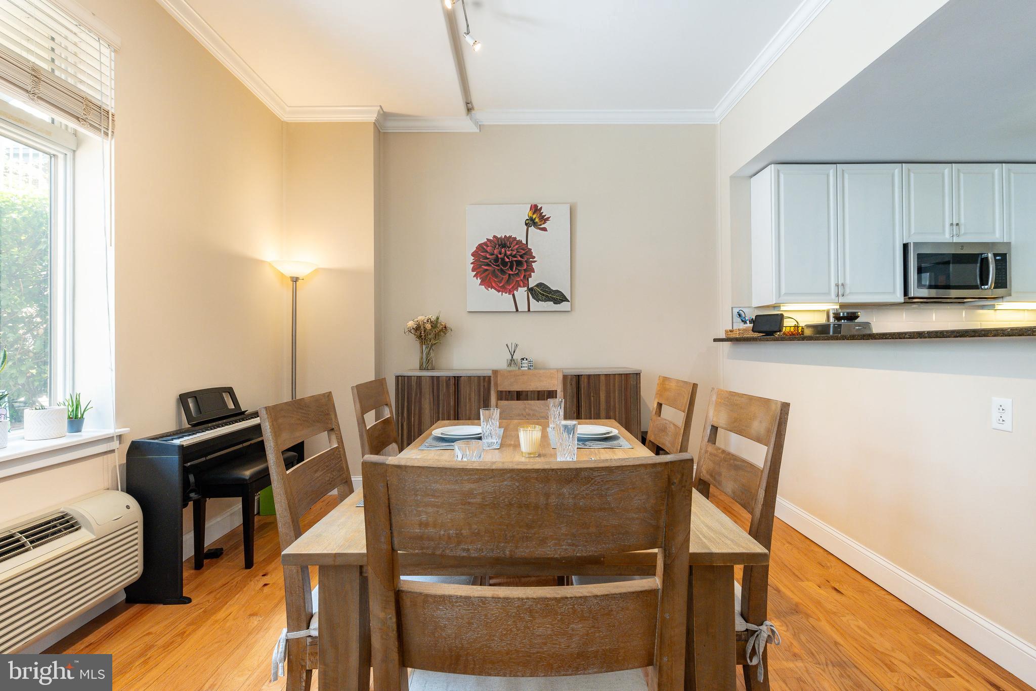 1900 Hamilton Street, Unit C6 Philadelphia, PA 19130 - Photo 8 of 37 a dining room with furniture and window