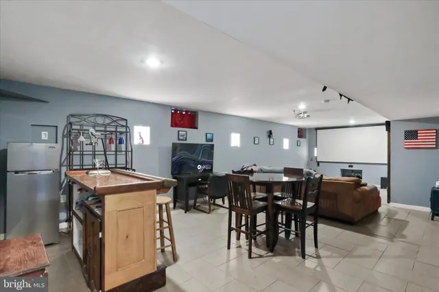 a view of a dining room with furniture and chandelier