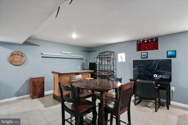 a view of a dining room with furniture and a chandelier