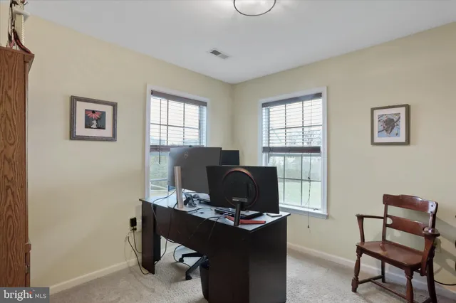 a workspace with furniture and a window