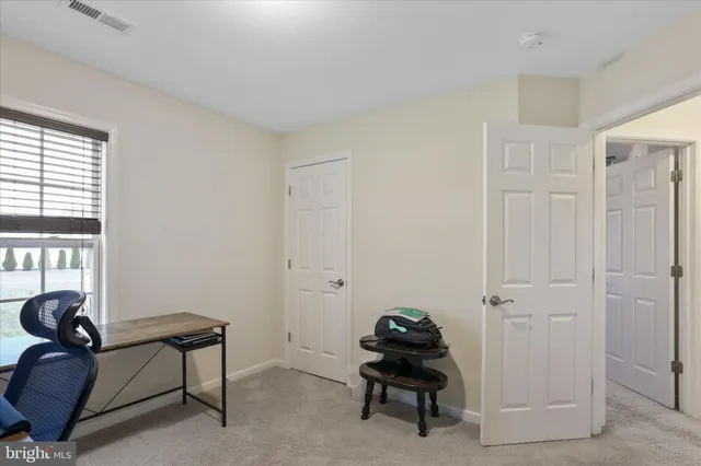 a room with furniture and a window