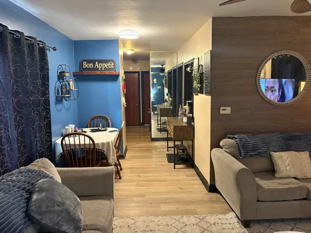 a living room with furniture and a window