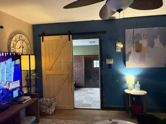 a lamp on a table in front of a room