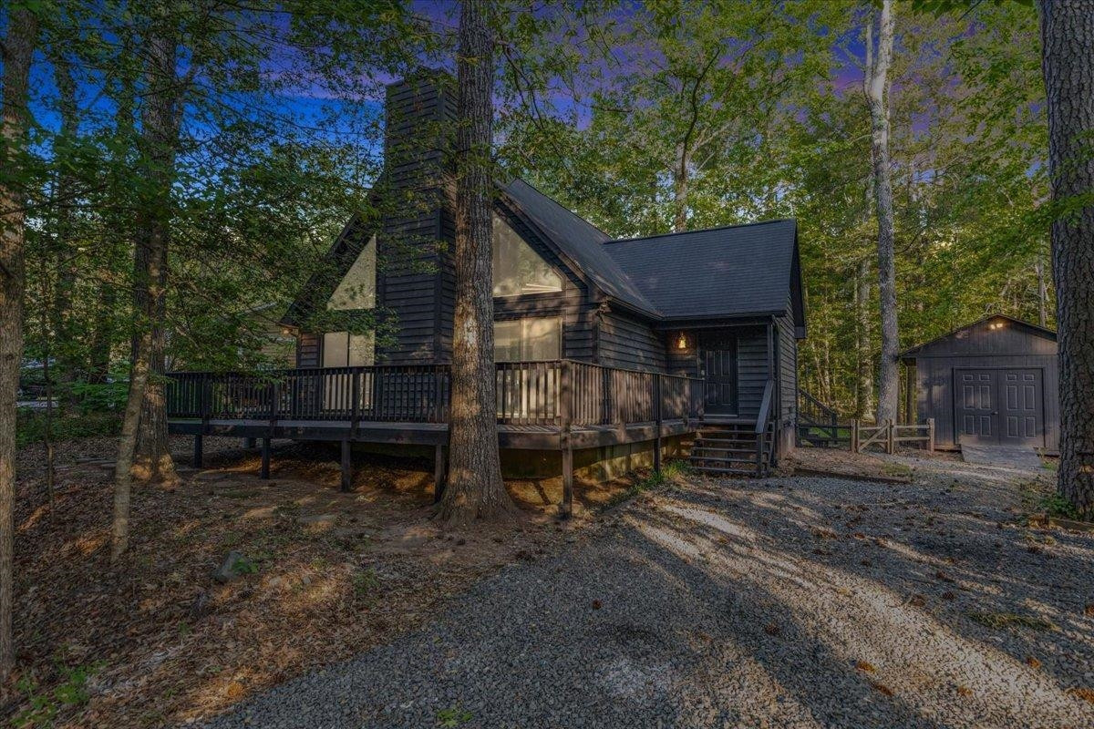 a backyard of a house with barbeque oven fire pit and outdoor seating
