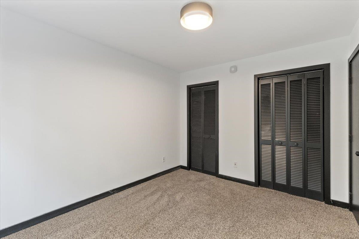 5433 Penrith Drive Durham, NC 27713 - Photo 19 of 47 an empty room with windows