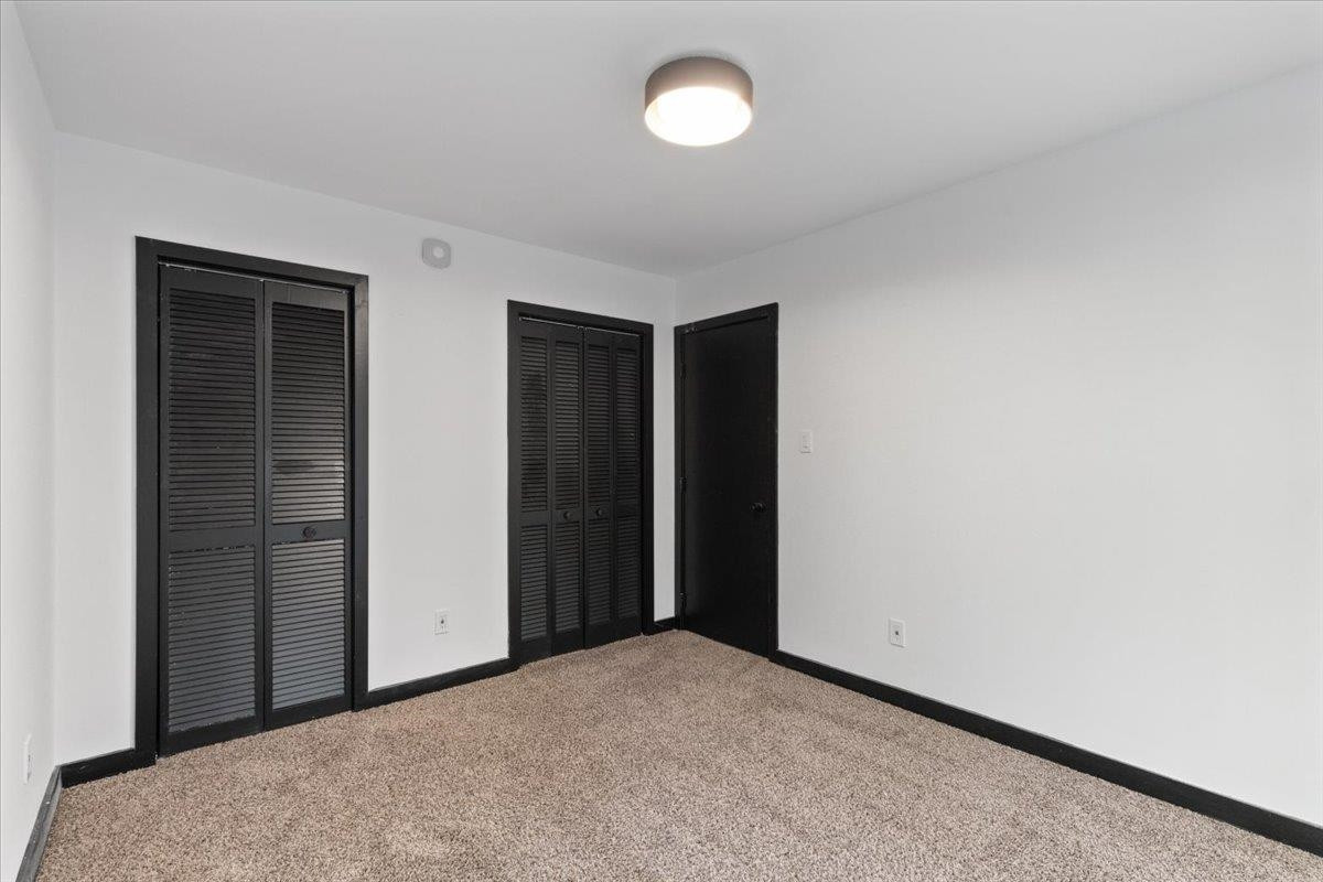 5433 Penrith Drive Durham, NC 27713 - Photo 20 of 47 an empty room with closet area