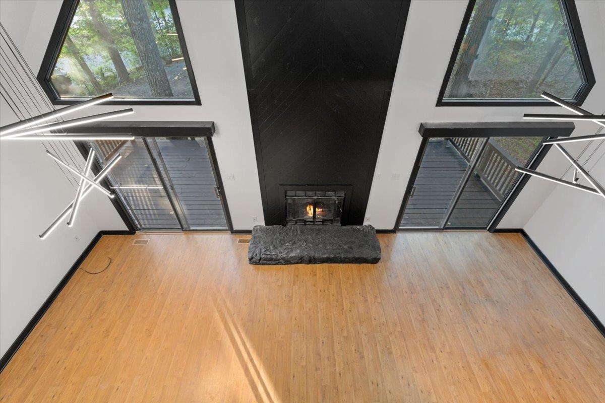 5433 Penrith Drive Durham, NC 27713 - Photo 25 of 47 a view of a fireplace with wooden floor