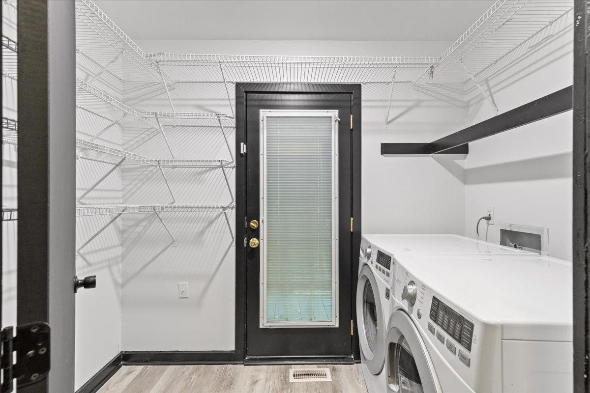 5433 Penrith Drive Durham, NC 27713 - Photo 34 of 47 a bathroom with a double vanity sink and a mirror