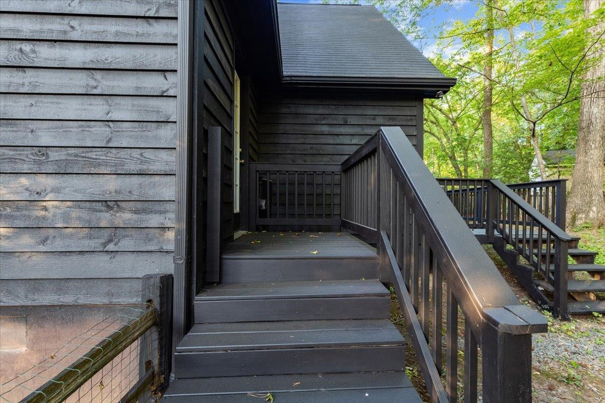 5433 Penrith Drive Durham, NC 27713 - Photo 36 of 47 a view of entryway with wooden stairs