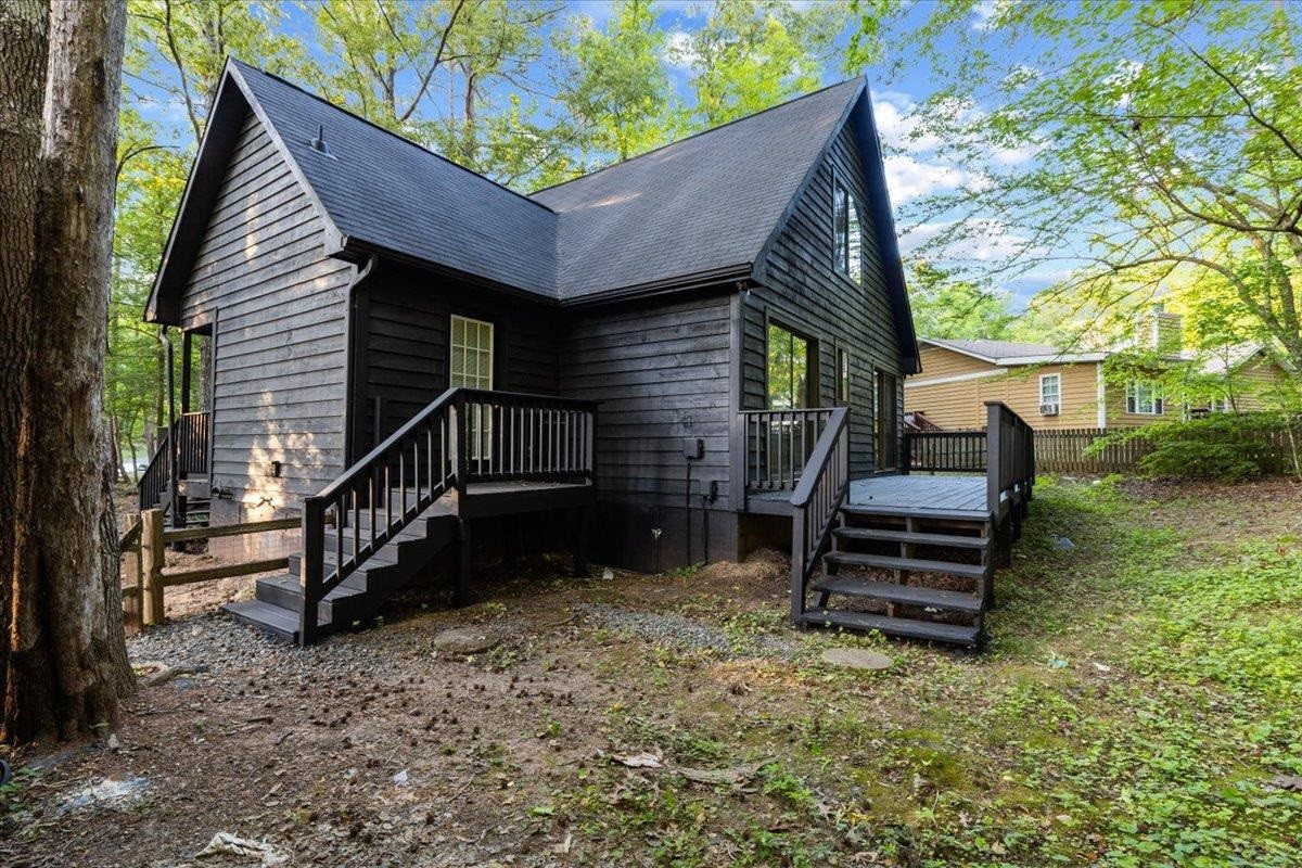 5433 Penrith Drive Durham, NC 27713 - Photo 39 of 47 a view of a house with backyard and wooden fence